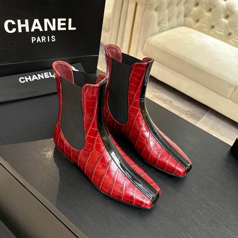 Chanel red crocodile-embossed leather Chelsea boots with black patent stripe, shown with Chanel box