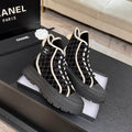 Chanel Black Quilted High-Top Sneakers with Cream Trim