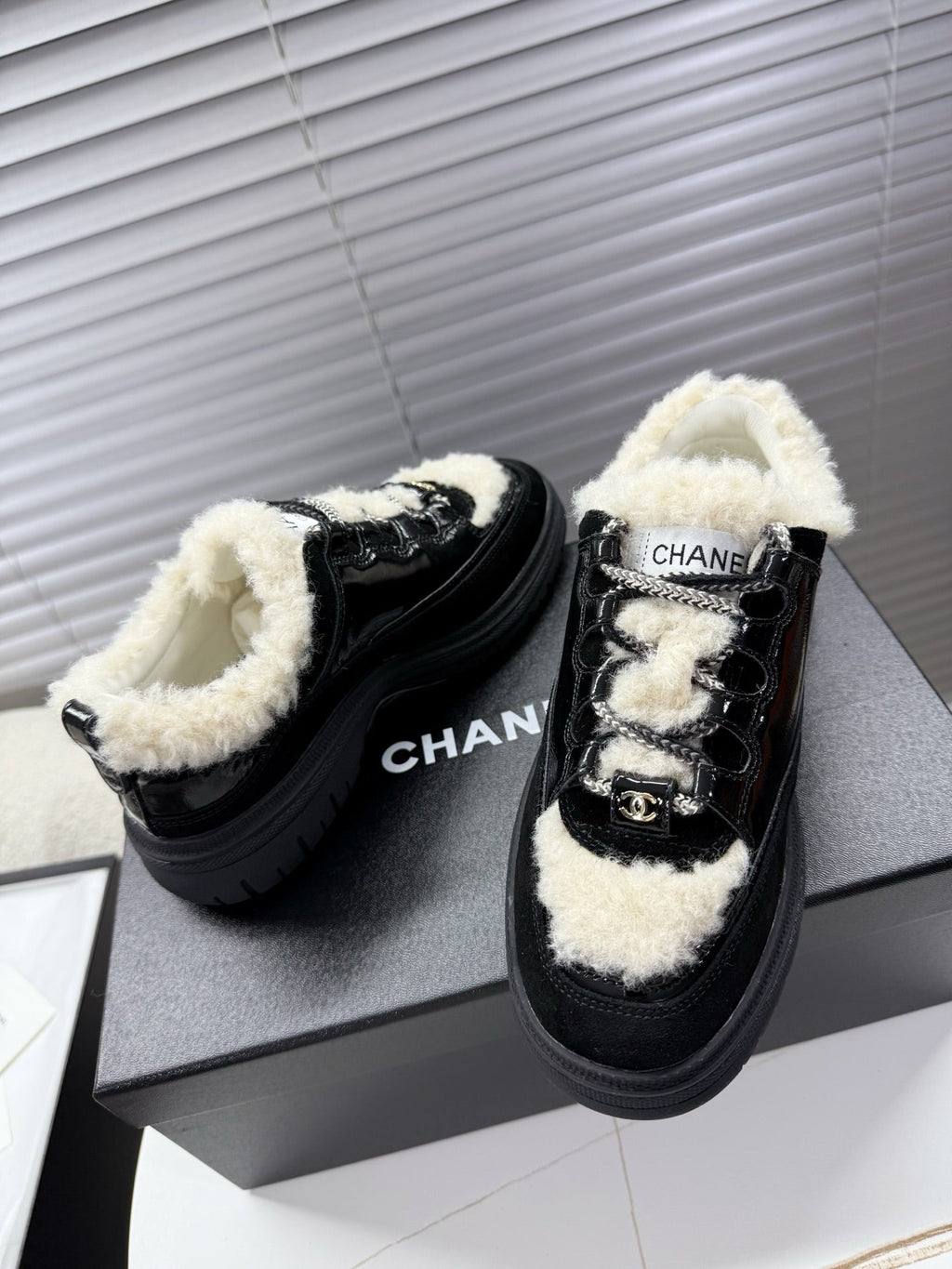 CHANEL 25S SNEAKERS WITH FUR AENTS 35MM IN BLACK CALFSKIN